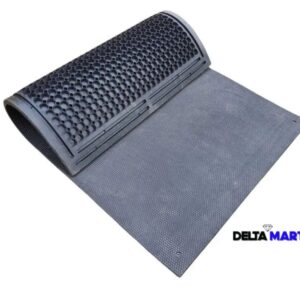 Roll-out rubber door mat with a textured perforated surface, partly rolled up