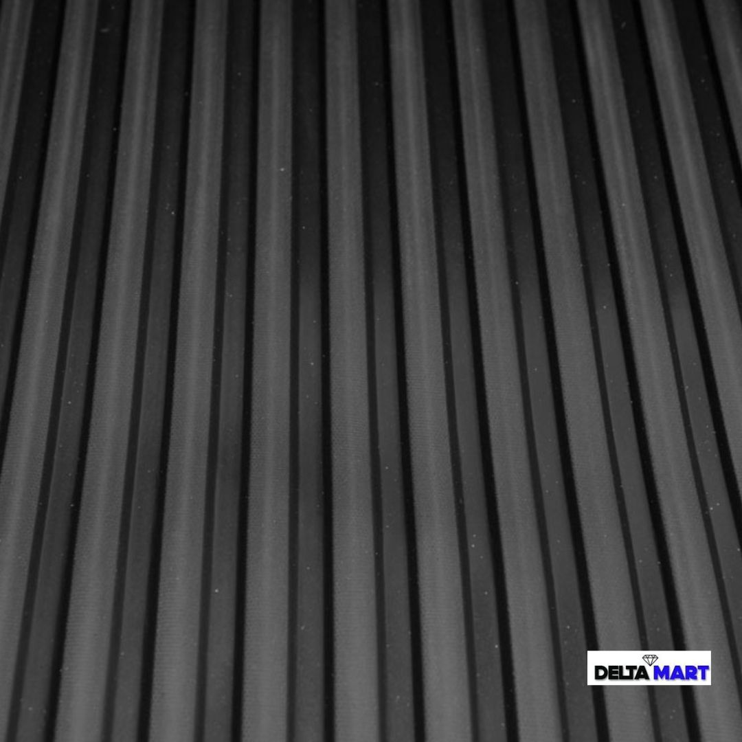 Close-up of a black ribbed surface with even vertical grooves; DeltaMart logo in the bottom-right corner.