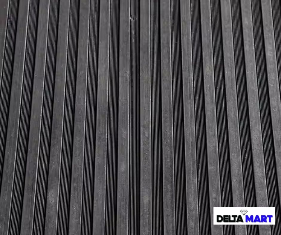 Close-up of ribbed metal strips arranged in parallel, forming a corrugated pattern, with a DeltaMART logo in the bottom-right corner.
