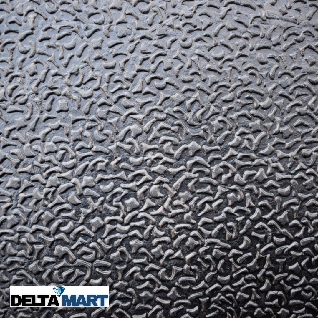Close-up of a textured black rubber mat with a wavy pebble pattern; Delta Mart logo in bottom-left corner.
