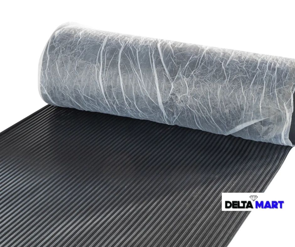 Roll of ribbed black rubber mat being unrolled; DeltaMart logo visible in the corner.