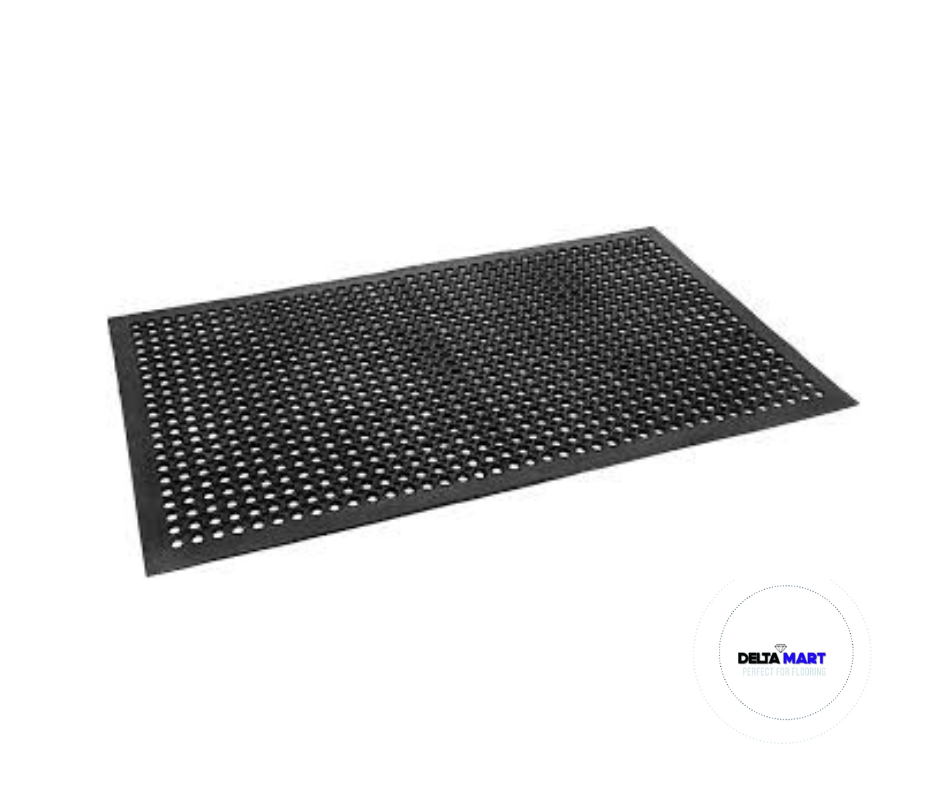Black perforated floor mat with evenly spaced circular holes for drainage and traction.