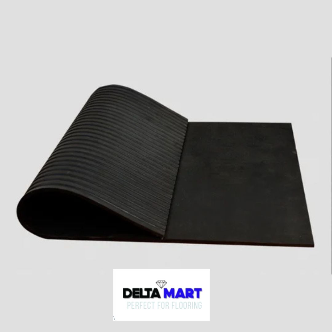 Flexible black rubber floor mat partially rolled up, with ribbed underside visible, set on a light background. DeltaMart logo shown below.