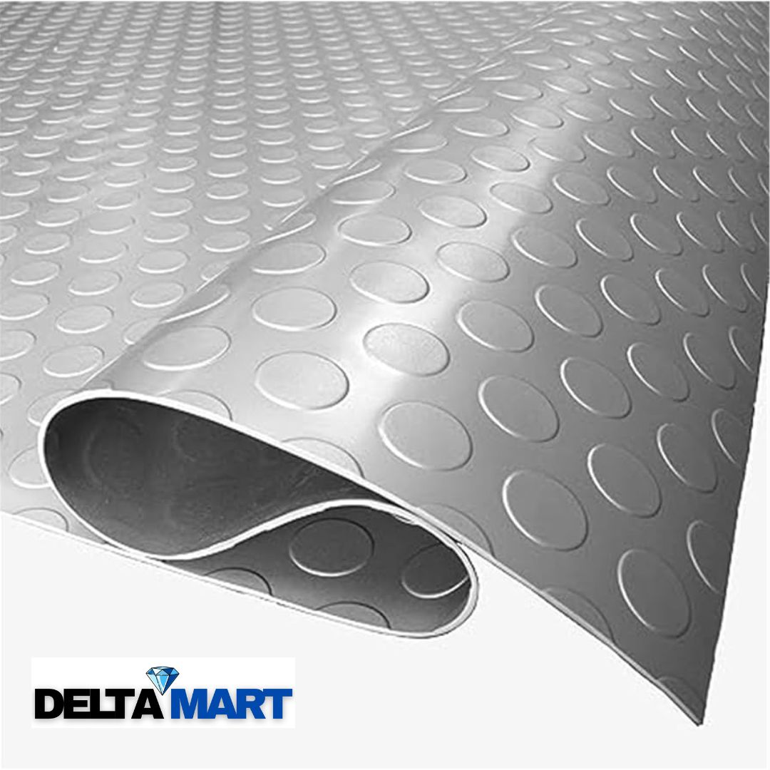 Close-up of a curved metal surface with repeating oval dimples and a rolled edge, featuring a Delta Mart logo in the bottom left corner.