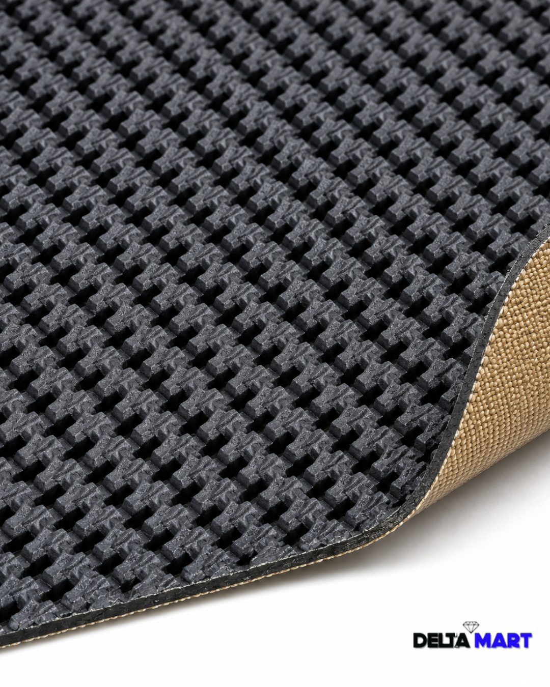 Close-up of a black waffle-textured floor mat with a beige edge and Delta Mart logo in the bottom corner.